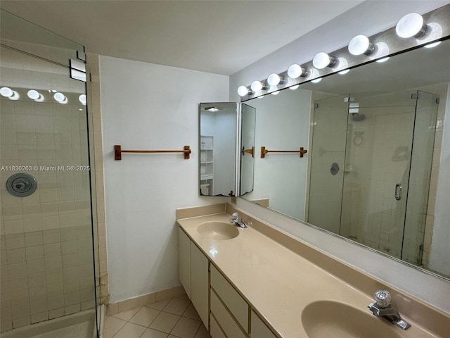 719 Mill Valley Pl, West Palm Beach, FL 33409 - full bathroom featuring tile patterned floors, a stall shower, and double vanity