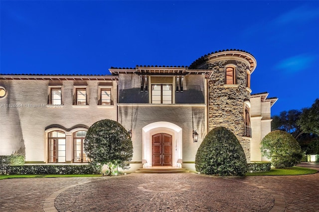 10101 SW 60th Ct, Pinecrest, FL 33156 - mediterranean / spanish home featuring stucco siding, curved driveway, and french doors