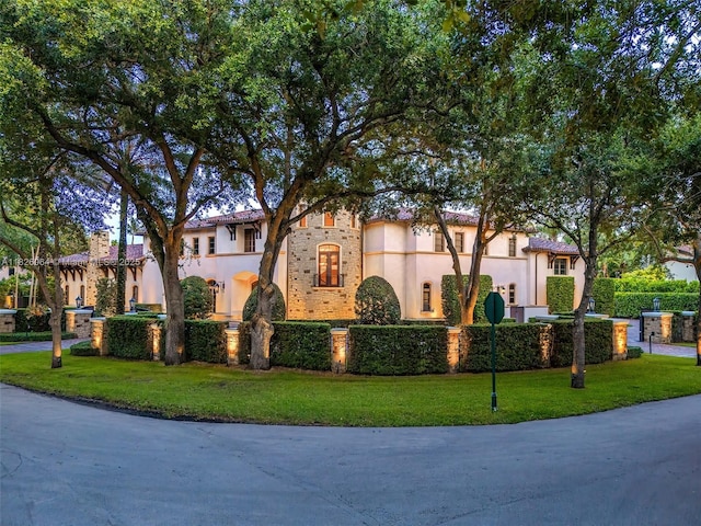 10101 SW 60th Ct, Pinecrest, FL 33156 - mediterranean / spanish house featuring stucco siding and a front yard