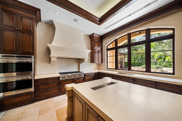 10101 SW 60th Ct, Pinecrest, FL 33156 - kitchen featuring stainless steel appliances, light countertops, backsplash, ornamental molding, and custom exhaust hood