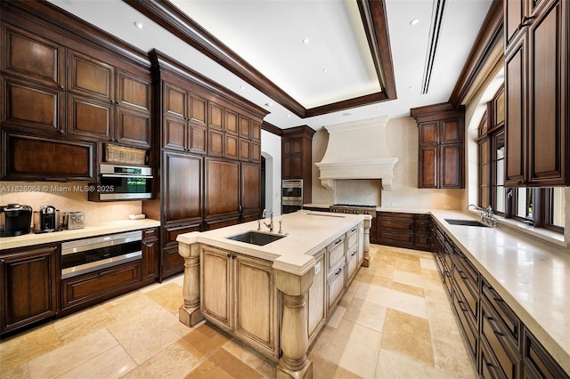 10101 SW 60th Ct, Pinecrest, FL 33156 - kitchen featuring custom exhaust hood, backsplash, a warming drawer, light countertops, and dark brown cabinets