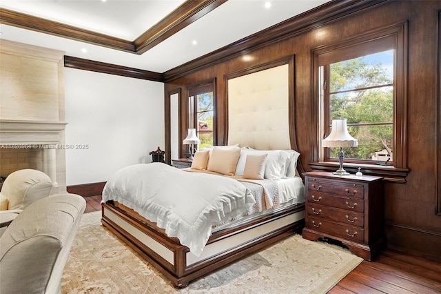 10101 SW 60th Ct, Pinecrest, FL 33156 - bedroom featuring multiple windows, light wood finished floors, and crown molding