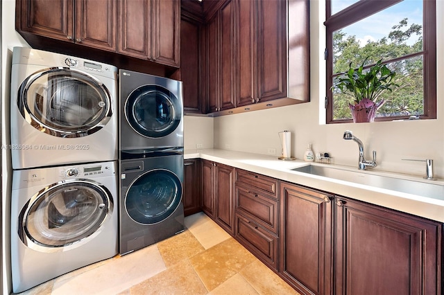10101 SW 60th Ct, Pinecrest, FL 33156 - laundry area featuring cabinet space, estacked washer and dryer, and plenty of natural light