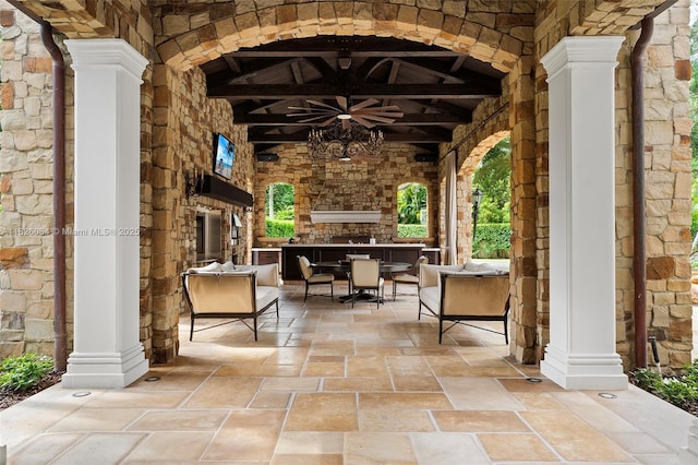 10101 SW 60th Ct, Pinecrest, FL 33156 - view of patio / terrace featuring an outdoor stone fireplace