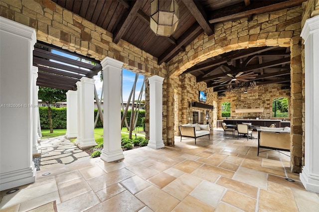10101 SW 60th Ct, Pinecrest, FL 33156 - view of patio / terrace featuring ceiling fan, an outdoor stone fireplace, and a pergola