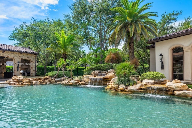 10101 SW 60th Ct, Pinecrest, FL 33156 - outdoor pool with exterior fireplace