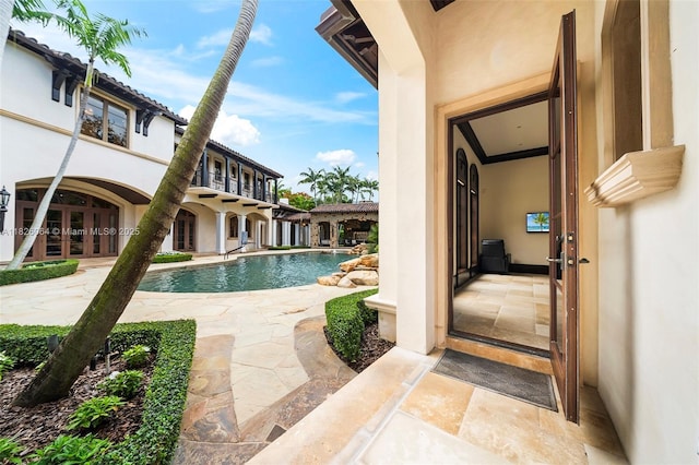 10101 SW 60th Ct, Pinecrest, FL 33156 - swimming pool with french doors and a patio