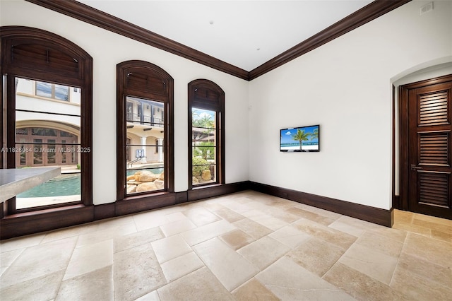 10101 SW 60th Ct, Pinecrest, FL 33156 - spare room featuring stone tile flooring and crown molding