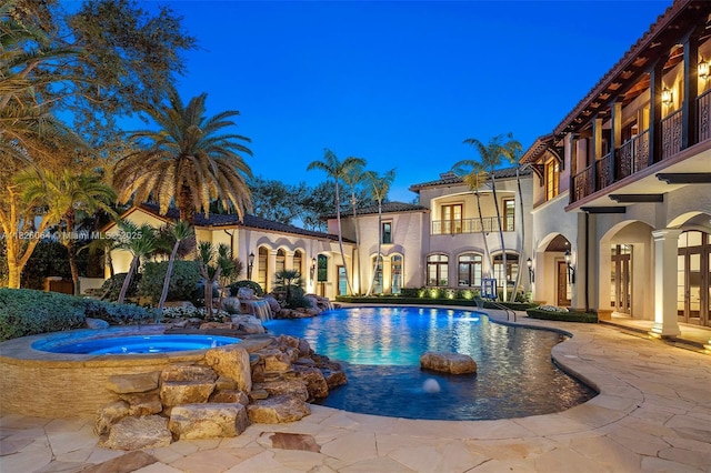 10101 SW 60th Ct, Pinecrest, FL 33156 - outdoor pool with an in-ground hot tub, a patio, and french doors