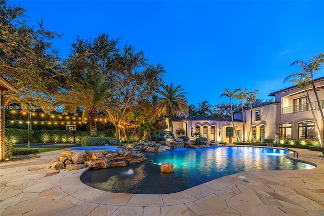 10101 SW 60th Ct, Pinecrest, FL 33156 - swimming pool with an in-ground hot tub and a patio area