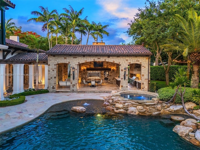 10101 SW 60th Ct, Pinecrest, FL 33156 - outdoor pool featuring a fireplace, a patio area, and an in-ground hot tub