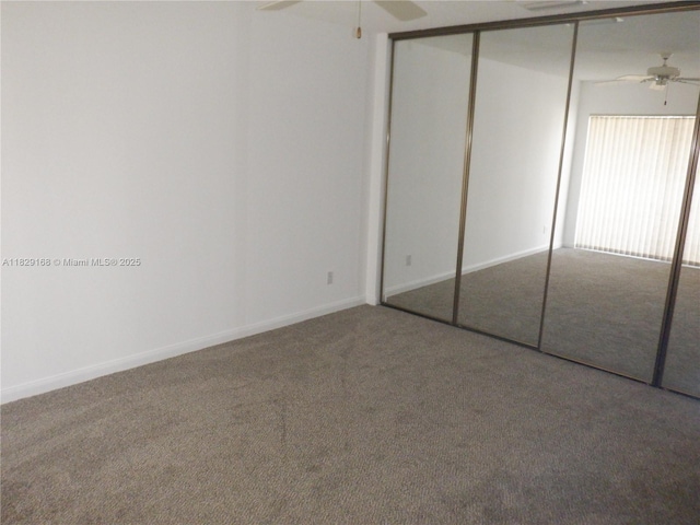 5103 Water Oak Ct, Palm Beach Gardens, FL 33410 - unfurnished bedroom featuring carpet flooring, a closet, and ceiling fan