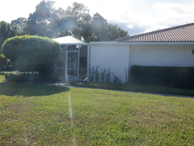 5103 Water Oak Ct, Palm Beach Gardens, FL 33410 - view of green lawn featuring glass enclosure