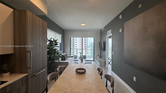 239 SW 9th St Unit 1604, Miami, FL 33130 - dining space with light tile patterned floors and baseboards