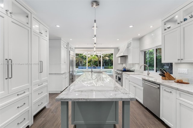 11401 SW 69th Ave, Pinecrest, FL 33156 - kitchen with high end appliances, decorative backsplash, dark wood finished floors, recessed lighting, and white cabinets