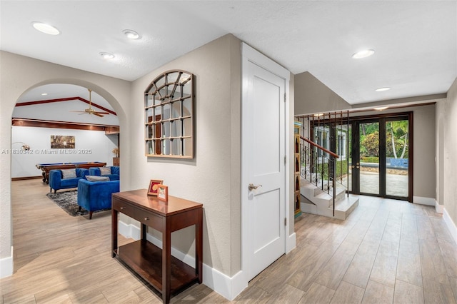 11401 SW 69th Ave, Pinecrest, FL 33156 - corridor featuring light wood-type flooring, arched walkways, stairway, and recessed lighting