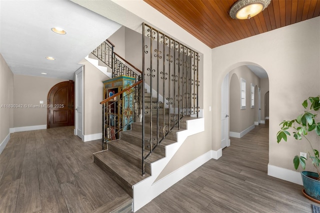 11401 SW 69th Ave, Pinecrest, FL 33156 - stairs featuring arched walkways, wood finished floors, recessed lighting, and wooden ceiling