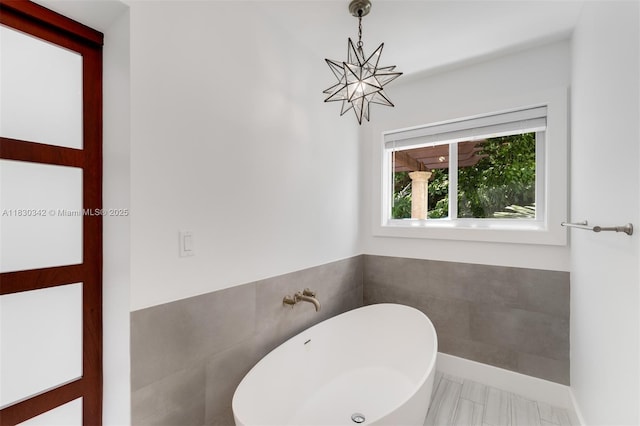 11401 SW 69th Ave, Pinecrest, FL 33156 - full bathroom featuring a chandelier and a freestanding bath