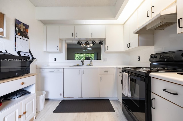 701 SW 141st Ave Unit 406R, Pembroke Pines, FL 33027 - kitchen with black appliances, light wood-type flooring, light countertops, white cabinets, and under cabinet range hood
