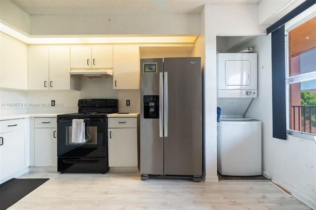 701 SW 141st Ave Unit 406R, Pembroke Pines, FL 33027 - kitchen with electric range, stainless steel fridge with ice dispenser, stacked washing machine and dryer, light countertops, and light wood-style flooring