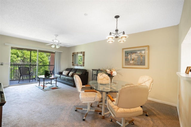 701 SW 141st Ave Unit 406R, Pembroke Pines, FL 33027 - dining area featuring carpet, a chandelier, ceiling fan, and a textured ceiling