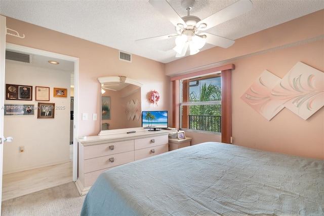 701 SW 141st Ave Unit 406R, Pembroke Pines, FL 33027 - bedroom with light colored carpet, a textured ceiling, and a ceiling fan