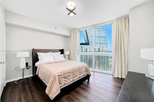 465 Brickell Ave Unit 5302, Miami, FL 33131 - bedroom featuring wood finished floors and floor to ceiling windows