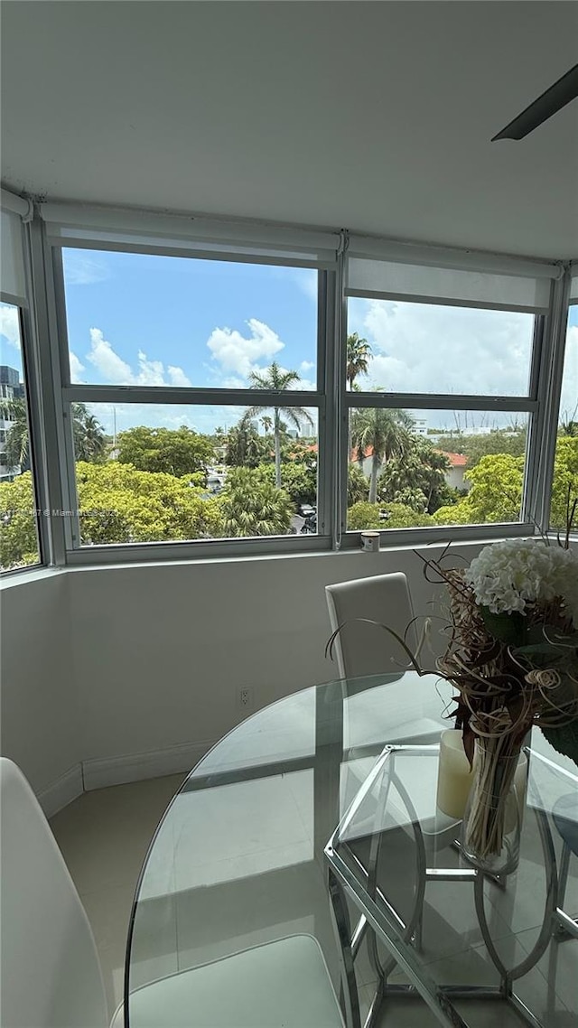 16546 NE 26th Ave Unit 4I, North Miami Beach, FL 33160 - dining space with plenty of natural light and tile patterned flooring