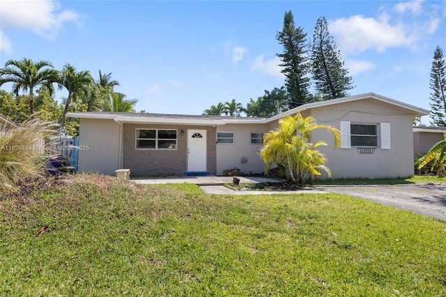 4960 SW 5th St, Margate, FL 33068 - ranch-style house featuring a front yard and stucco siding