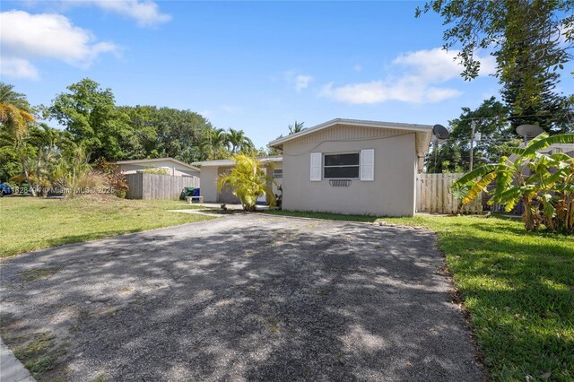4960 SW 5th St, Margate, FL 33068 - view of front facade featuring driveway and stucco siding