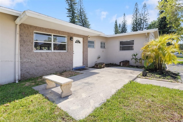 4960 SW 5th St, Margate, FL 33068 - property entrance featuring stucco siding and a patio