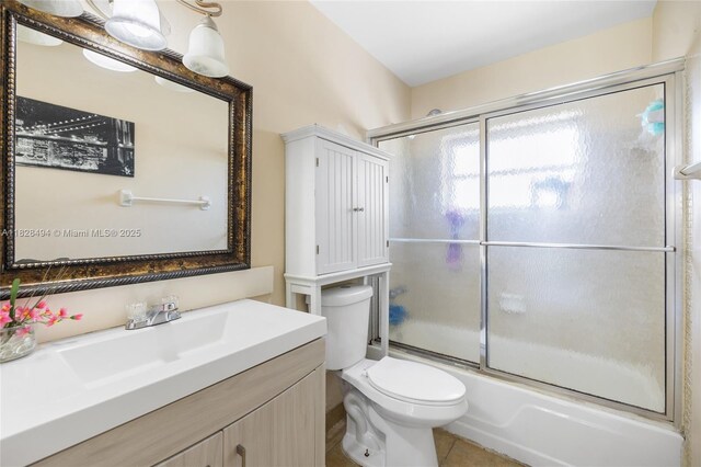4960 SW 5th St, Margate, FL 33068 - bathroom featuring vanity, bath / shower combo with glass door, and tile patterned flooring