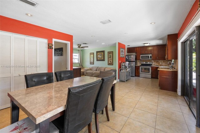4960 SW 5th St, Margate, FL 33068 - dining space featuring healthy amount of natural light, light tile patterned flooring, a ceiling fan, and recessed lighting