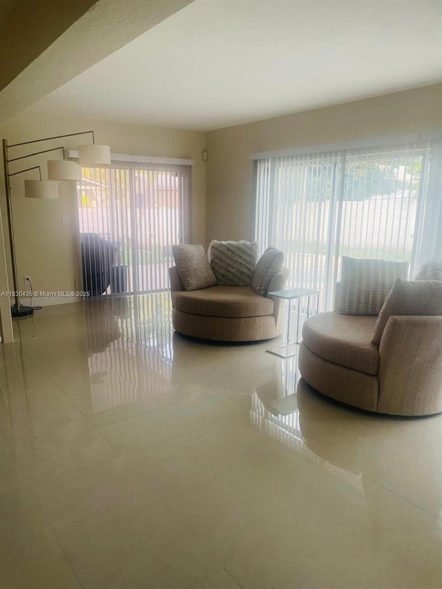 6790 SW 10th Ct, Pembroke Pines, FL 33023 - tiled living area featuring baseboards