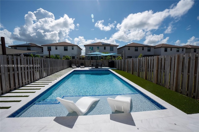 25433 SW 108th Ct, Homestead, FL 33032 - view of swimming pool featuring a residential view and a fenced backyard