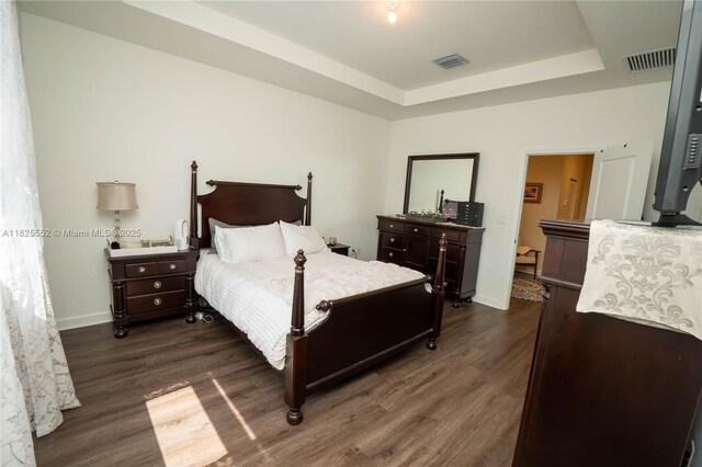 25433 SW 108th Ct, Homestead, FL 33032 - bedroom featuring dark wood-style floors and a tray ceiling