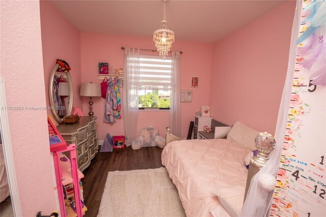 25433 SW 108th Ct, Homestead, FL 33032 - bedroom featuring wood finished floors and a chandelier