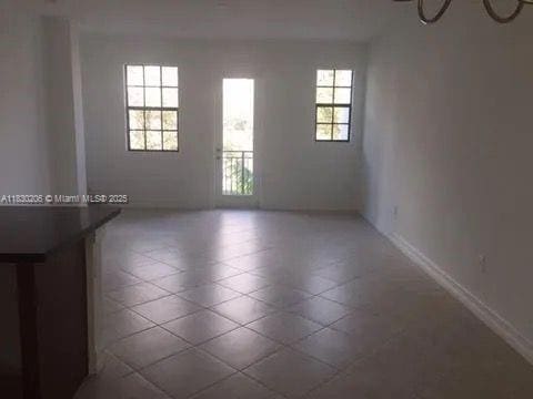11332 SW 15th St, Pembroke Pines, FL 33025 - unfurnished room featuring baseboards