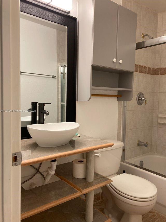 2519 Washington St, Hollywood, FL 33020 - bathroom with tub / shower combination and vanity