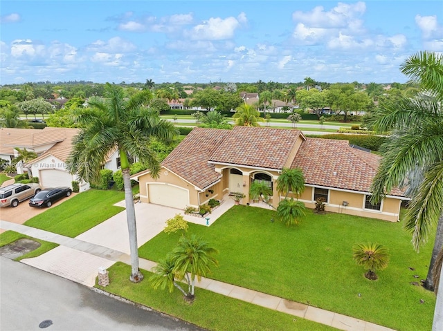 450 NW 195th Ave, Pembroke Pines, FL 33029 - view of front facade with stucco siding, driveway, an attached garage, and a tile roof