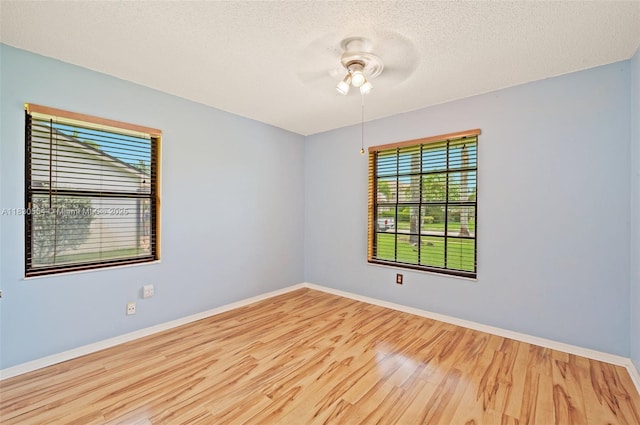 450 NW 195th Ave, Pembroke Pines, FL 33029 - empty room with wood finished floors, ceiling fan, and a textured ceiling