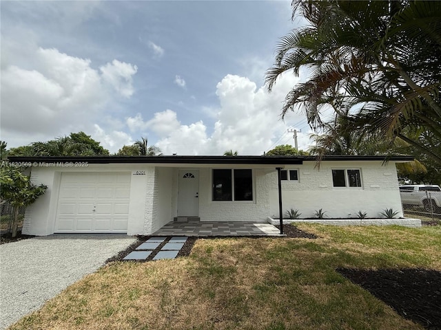 6201 SW 20th Ct, Miramar, FL 33023 - single story home featuring a garage, a front yard, gravel driveway, and a porch