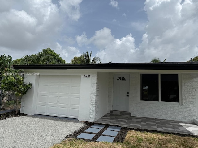 6201 SW 20th Ct, Miramar, FL 33023 - ranch-style home with brick siding and a garage