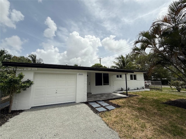 6201 SW 20th Ct, Miramar, FL 33023 - ranch-style home with a garage, asphalt driveway, and stucco siding