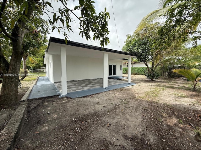 6201 SW 20th Ct, Miramar, FL 33023 - view of property exterior with french doors and a patio