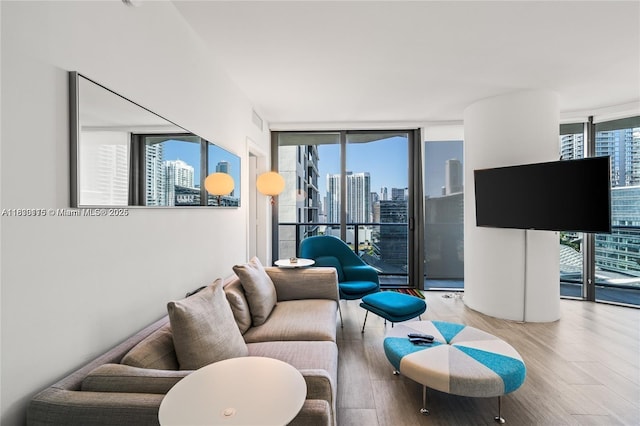 55 SW 9th St Unit 1801, Miami, FL 33130 - living area with wood finished floors and a wall of windows