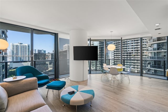 55 SW 9th St Unit 1801, Miami, FL 33130 - living room featuring floor to ceiling windows and wood finished floors