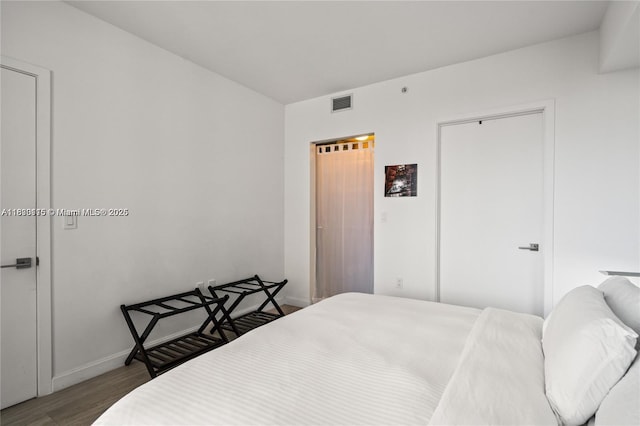 55 SW 9th St Unit 1801, Miami, FL 33130 - bedroom with wood finished floors and baseboards