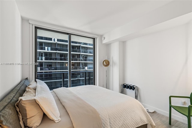 55 SW 9th St Unit 1801, Miami, FL 33130 - bedroom featuring wood finished floors and baseboards