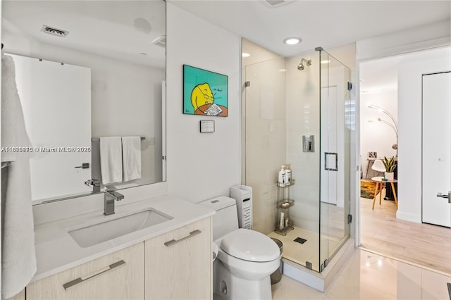 55 SW 9th St Unit 1801, Miami, FL 33130 - full bathroom featuring vanity, a shower stall, recessed lighting, and tile patterned flooring